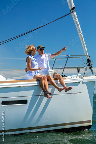 Successful senior couple relaxing sitting on luxury yacht © Spotmatik