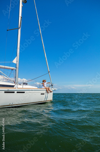 Luxury yacht sailing ocean with senior couple relaxing
