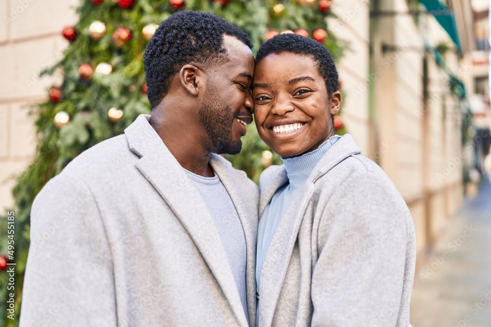 Fototapeta premium Man and woman couple smiling confident standing together at street