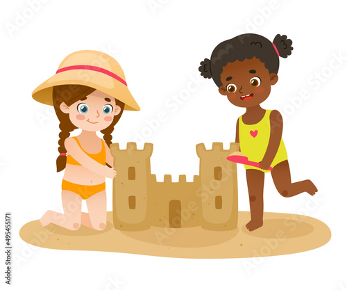 Cute girls building sand castle on the beach. Happy kids make sand tower. Summertime children's entertainment.