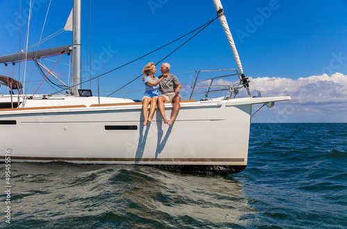 Loving senior male and female on luxury yacht