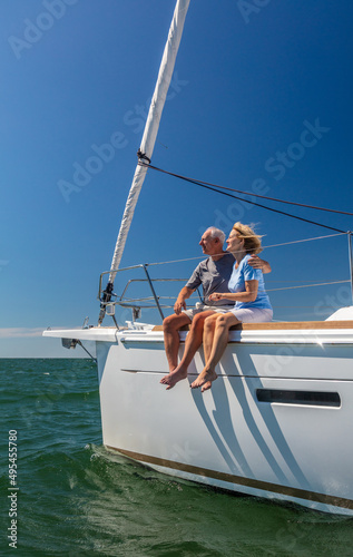 Outdoor loving senior couple relaxing on luxury yacht