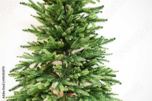 Christmas artificial tree without decoration. Green fir twigs