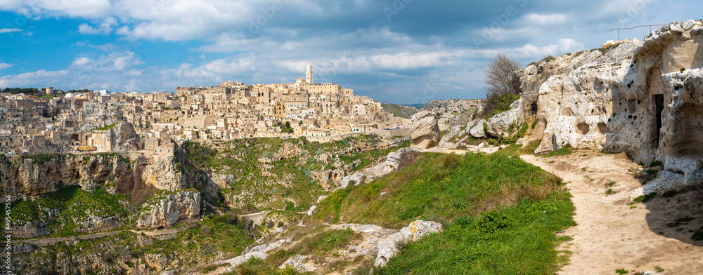Matera - The cityscape panorama with the old cave chapels and the walley.