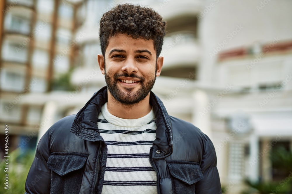 Young arab man smiling outdoor at the town Young arab man smiling outdoor at the town