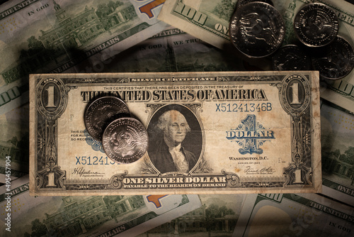 Dollar coins on Dollar banknote. Old historic money