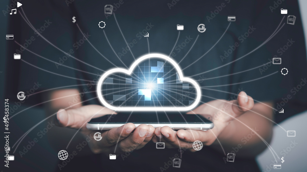 Cloud technology,Technology transformation, Data security concept. Hand holding virtual screen cloud icons Downloading and uploading data application on smartphone. Cloud technology,Technology transformation, Data security concept. Hand holding virtual screen cloud icons Downloading and uploading data application on smartphone.