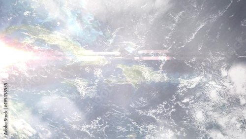 Earth zoom in from outer space to city. Zooming on Gonaives, Haiti. The animation continues by zoom out through clouds and atmosphere into space. Images from NASA photo