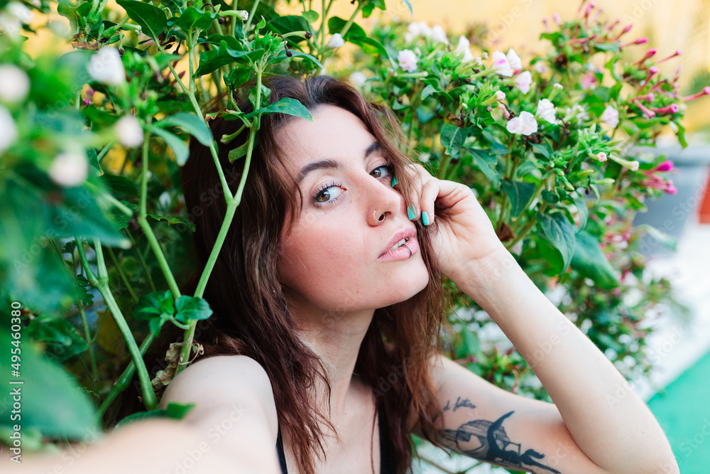 Photo of adorable young woman making selfie outdoors backyard Photo of adorable young woman making selfie outdoors backyard