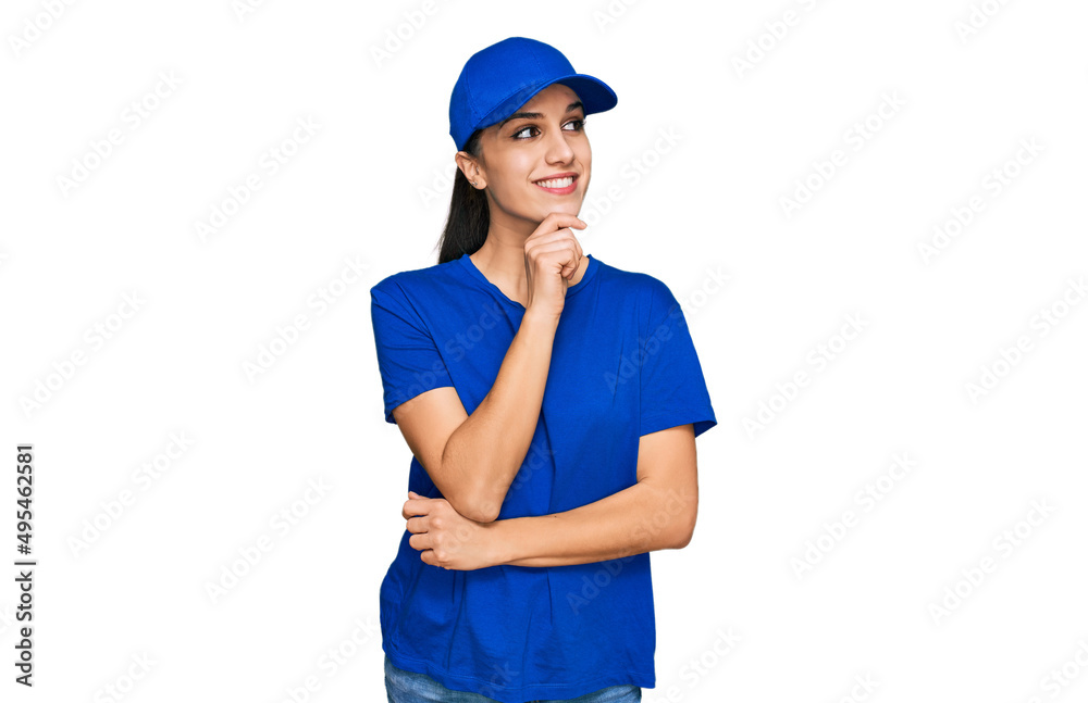 Young hispanic girl wearing delivery courier uniform with hand on chin thinking about question, pensive expression. smiling with thoughtful face. doubt concept. Young hispanic girl wearing delivery courier uniform with hand on chin thinking about question, pensive expression. smiling with thoughtful face. doubt concept.