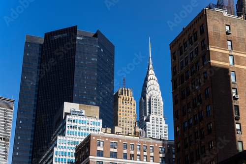 Chrysler Building stands among Midtown Manhattan skyscraper on October 21, 2021 in New York City NY USA.