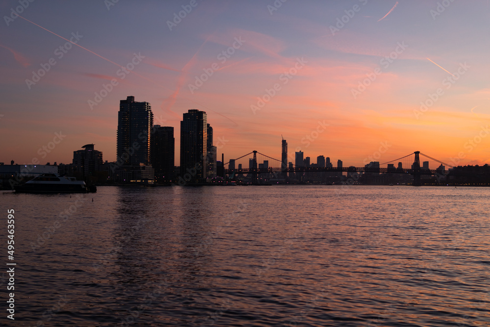 Colorful Sunset along the East River in New York City with the Williamsburg Bridge