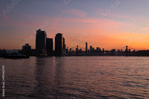 Colorful Sunset along the East River in New York City with the Williamsburg Bridge