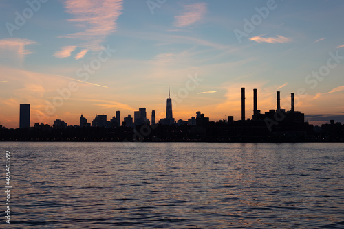 Lower Manhattan Skyline Silhouette during a Colorful Sunset along the East River in New York City