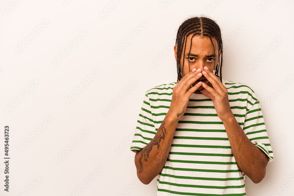Young African American man isolated on white background making up plan in mind, setting up an idea. Young African American man isolated on white background making up plan in mind, setting up an idea.