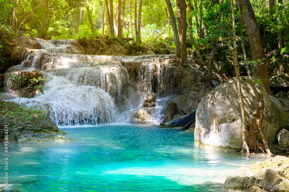 Naklejka premium Beautiful waterfall and emerald pool in tropical rain forest in Thailand...