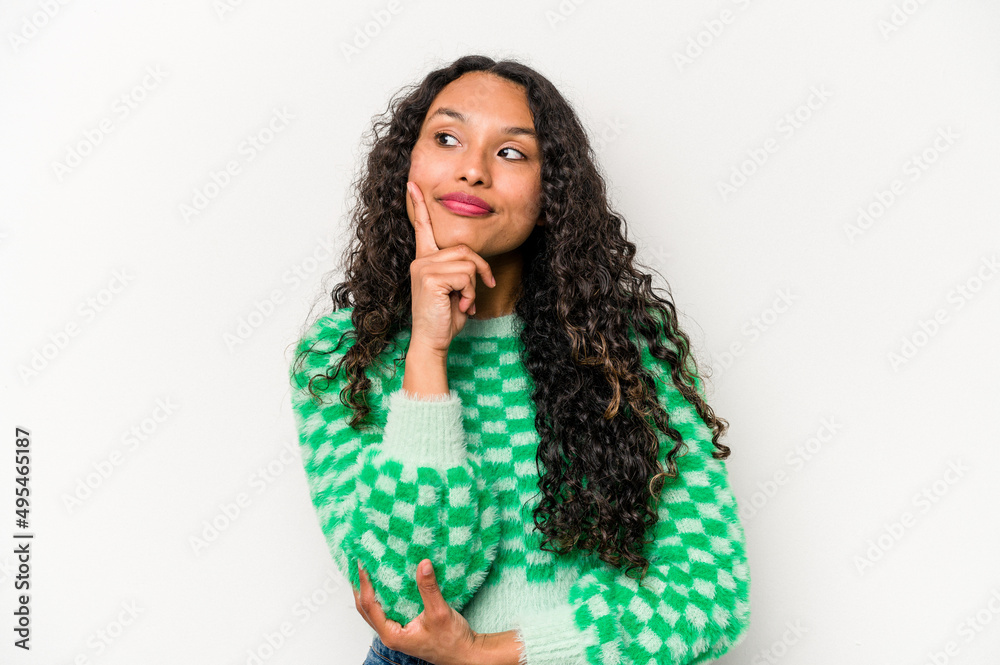 Young hispanic woman isolated on white background contemplating, planning a strategy, thinking about the way of a business. Young hispanic woman isolated on white background contemplating, planning a strategy, thinking about the way of a business.