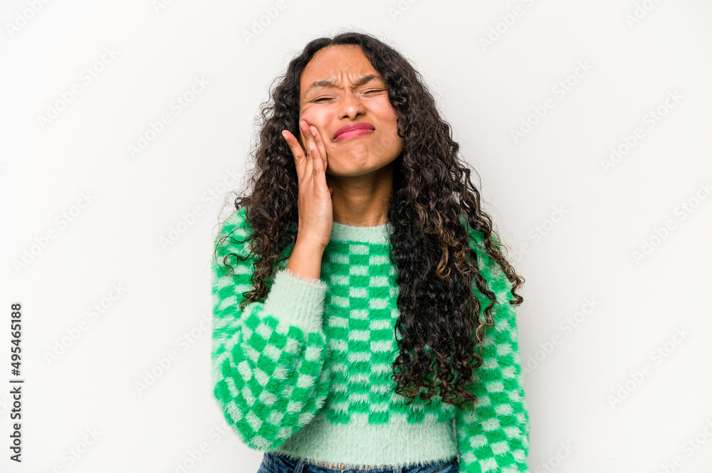 Young hispanic woman isolated on white background having a strong teeth pain, molar ache. Young hispanic woman isolated on white background having a strong teeth pain, molar ache.