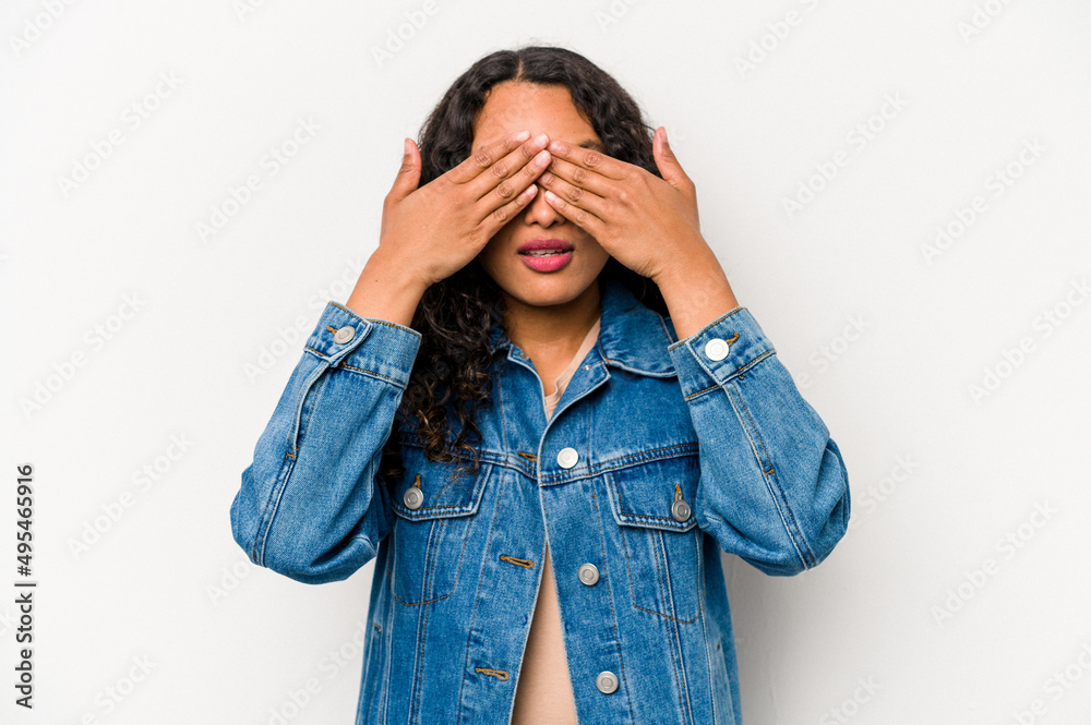 Young hispanic woman isolated on white background afraid covering eyes with hands. Young hispanic woman isolated on white background afraid covering eyes with hands.