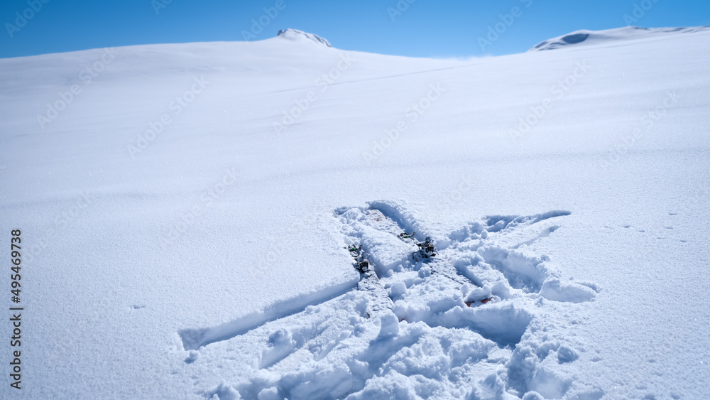 Ski touring skiers in Bucegi Mountains on a beautiful sunny day Ski touring skiers in Bucegi Mountains on a beautiful sunny day