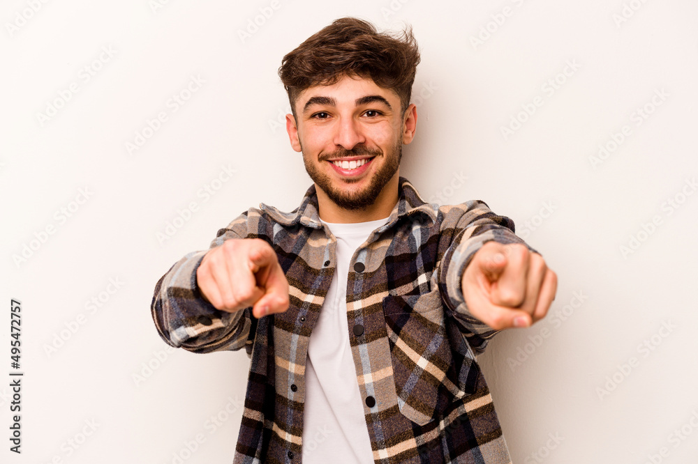 Young hispanic man isolated on white background cheerful smiles pointing to front. Young hispanic man isolated on white background cheerful smiles pointing to front.