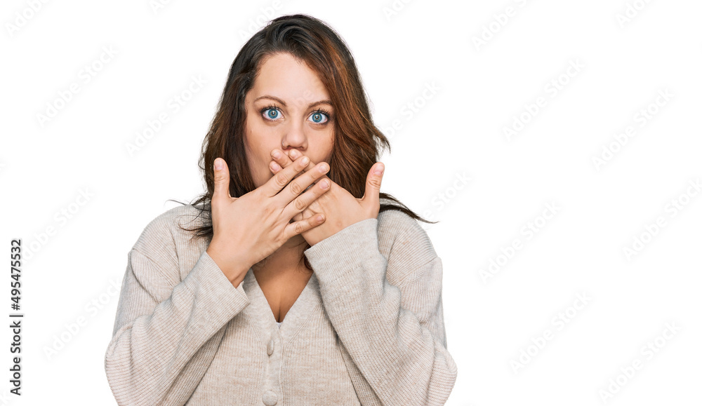 Young plus size woman wearing casual clothes shocked covering mouth with hands for mistake. secret concept. Young plus size woman wearing casual clothes shocked covering mouth with hands for mistake. secret concept.