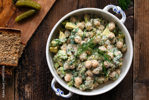 Creamy chickpea salad with avocado, dill, onion and mustard sauce