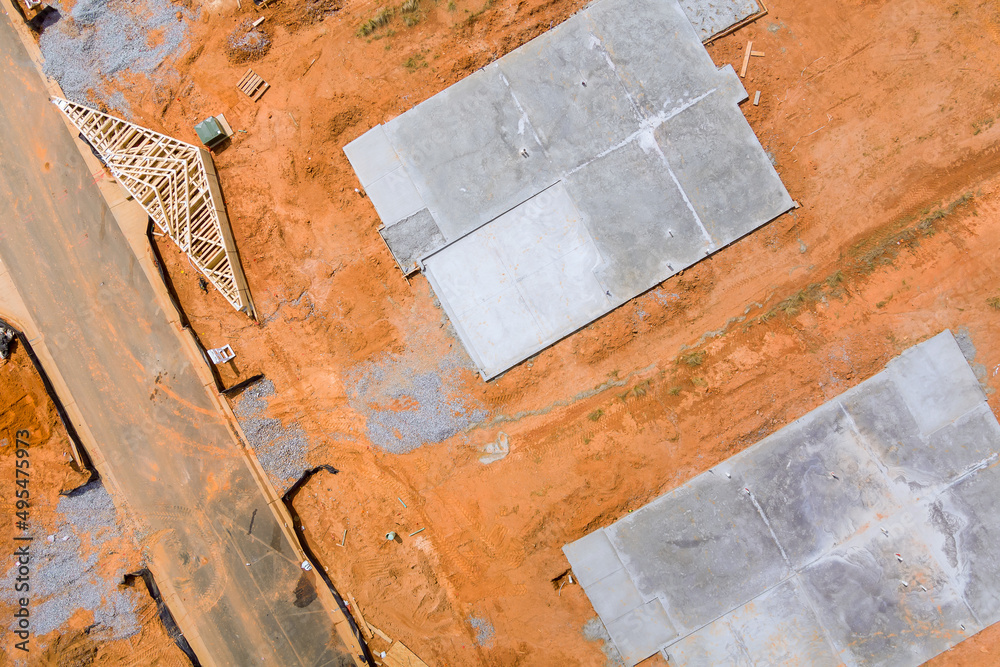 Construction site aerial views of new home concrete foundation
