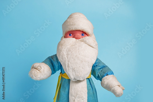 A toy Russian Ded Moroz on a blue background