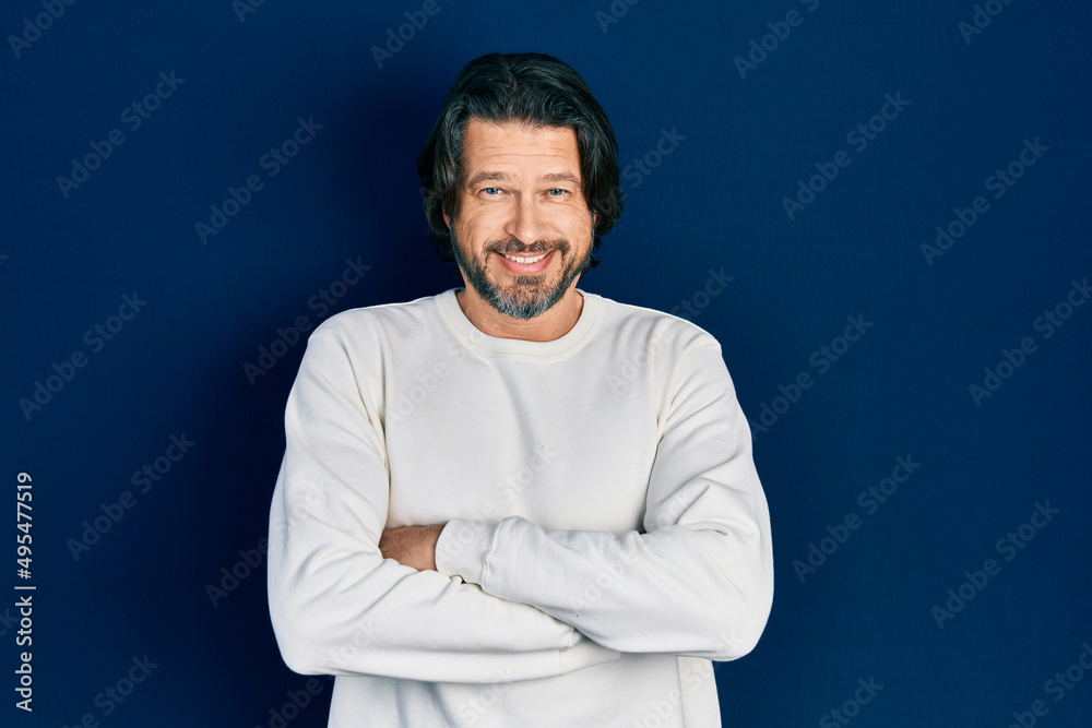 Middle age caucasian man wearing casual clothes happy face smiling with crossed arms looking at the camera. positive person.