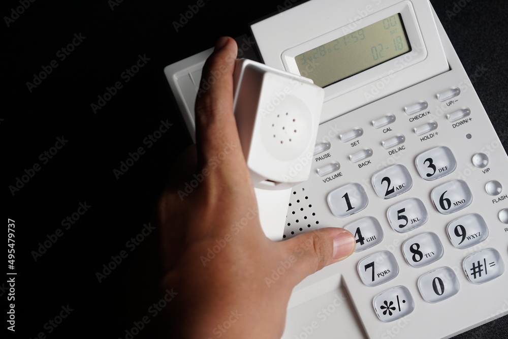 Telephone on the office desk dark Telephone on the office desk dark