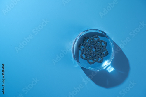 crystal paperweight against blue background photo