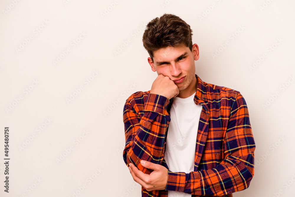 Young caucasian man isolated on white background who feels sad and pensive, looking at copy space. Young caucasian man isolated on white background who feels sad and pensive, looking at copy space.