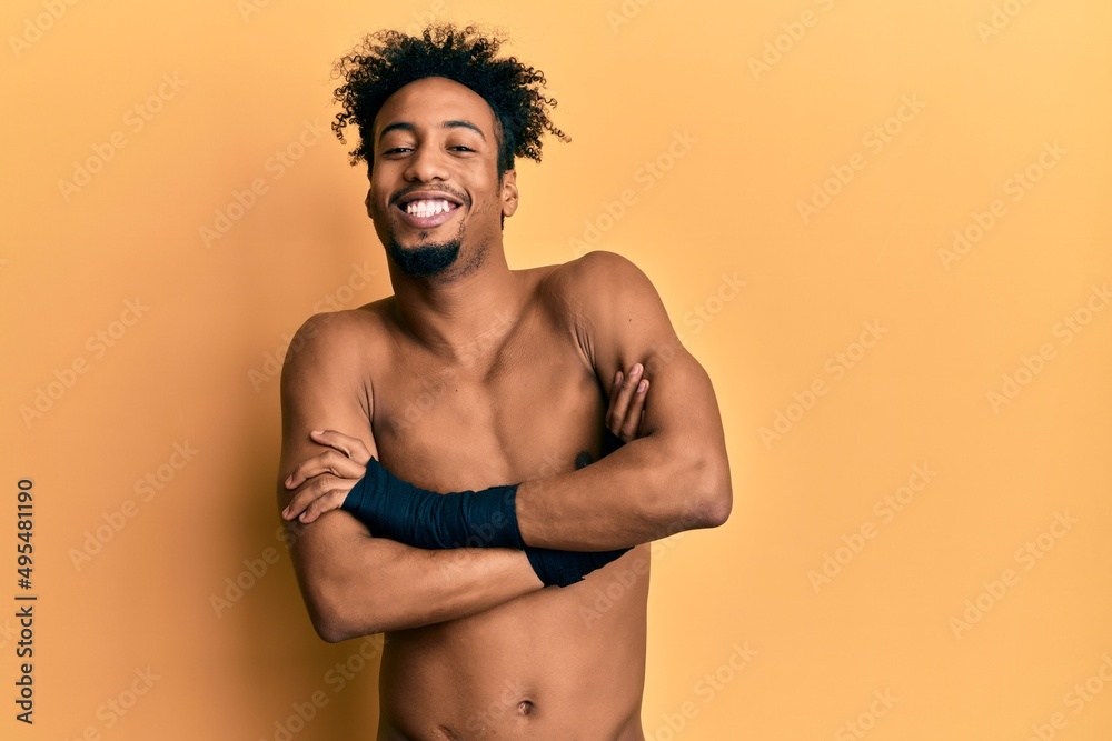 Young african american man with beard using boxing protection happy face smiling with crossed arms looking at the camera. positive person. Young african american man with beard using boxing protection happy face smiling with crossed arms looking at the camera. positive person.