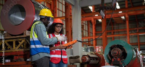 Photos Two technicians Inspecting and testing the operation of lifting cranes in heavy industrial plants