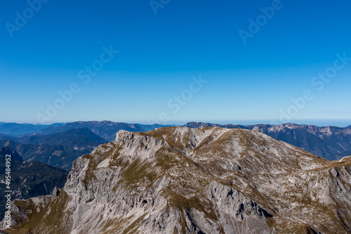 Panoramic view on the mountain peaks of the Hochschwab Region in Upper Styria, Austria. Sharp summit of Riegerin in the beautiful Alps in Europe. Climbing tourism, wilderness. Concept freedom