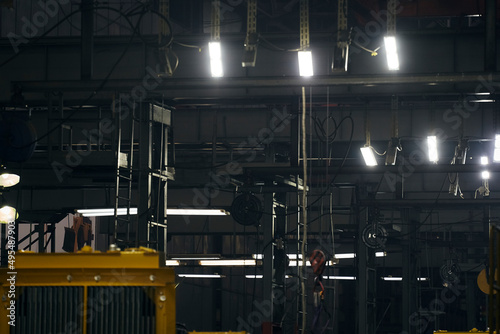 a lamp burning in the dark of factories