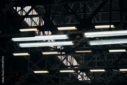 a lamp burning in the dark of factories