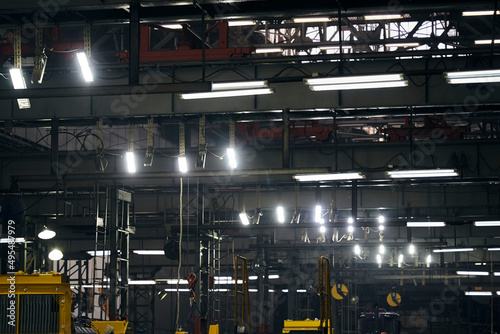a lamp burning in the dark of factories