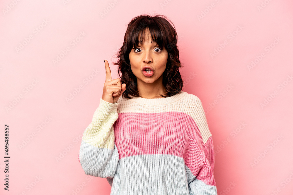 Young hispanic woman isolated on pink background having some great idea, concept of creativity. Young hispanic woman isolated on pink background having some great idea, concept of creativity.