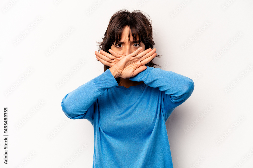 Young hispanic woman isolated on white background doing a denial gesture Young hispanic woman isolated on white background doing a denial gesture