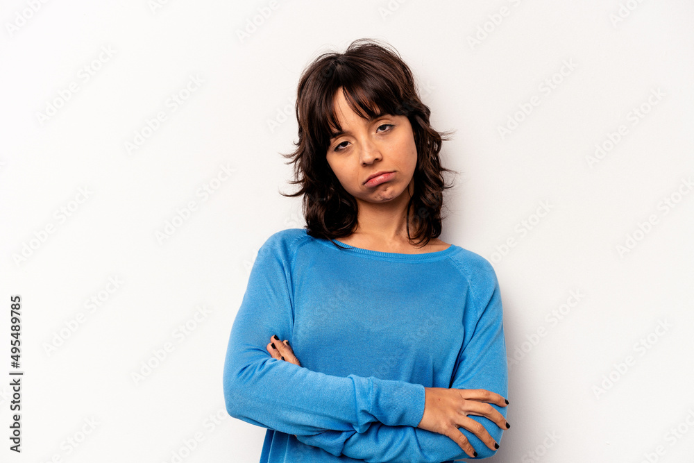 Young hispanic woman isolated on white background who is bored, fatigued and need a relax day. Young hispanic woman isolated on white background who is bored, fatigued and need a relax day.