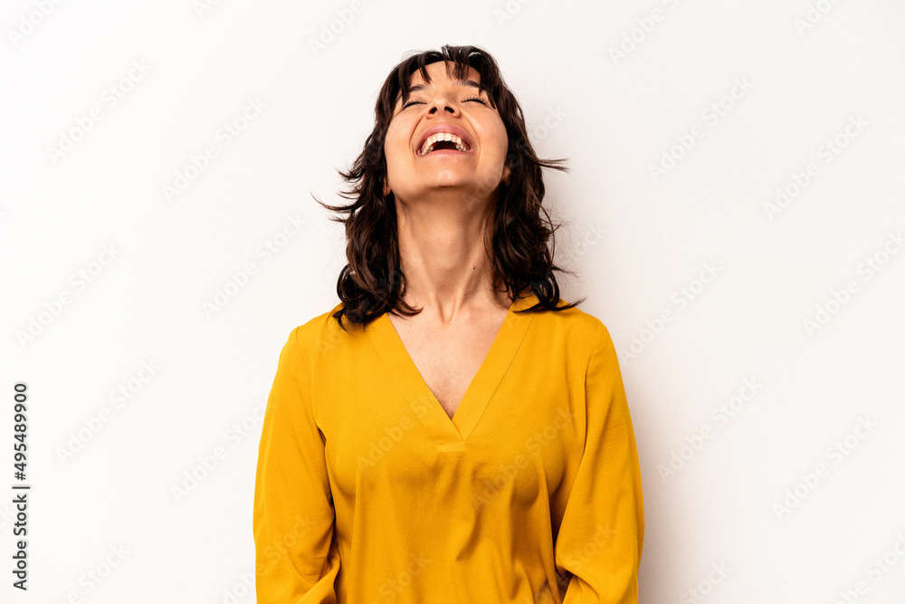 Young hispanic woman isolated on white background relaxed and happy laughing, neck stretched showing teeth. Young hispanic woman isolated on white background relaxed and happy laughing, neck stretched showing teeth.