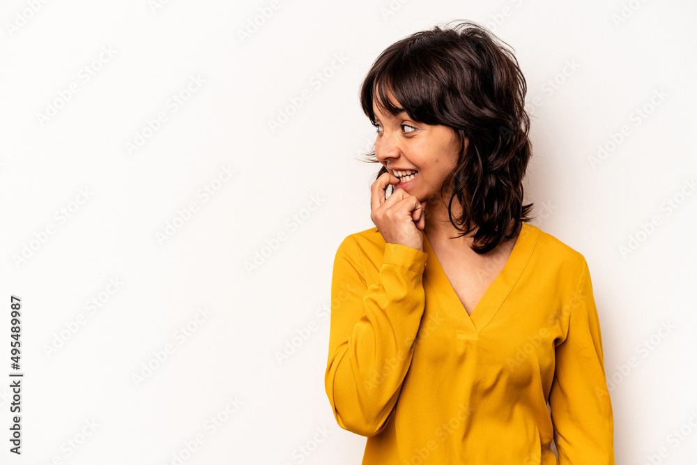Young hispanic woman isolated on white background relaxed thinking about something looking at a copy space.