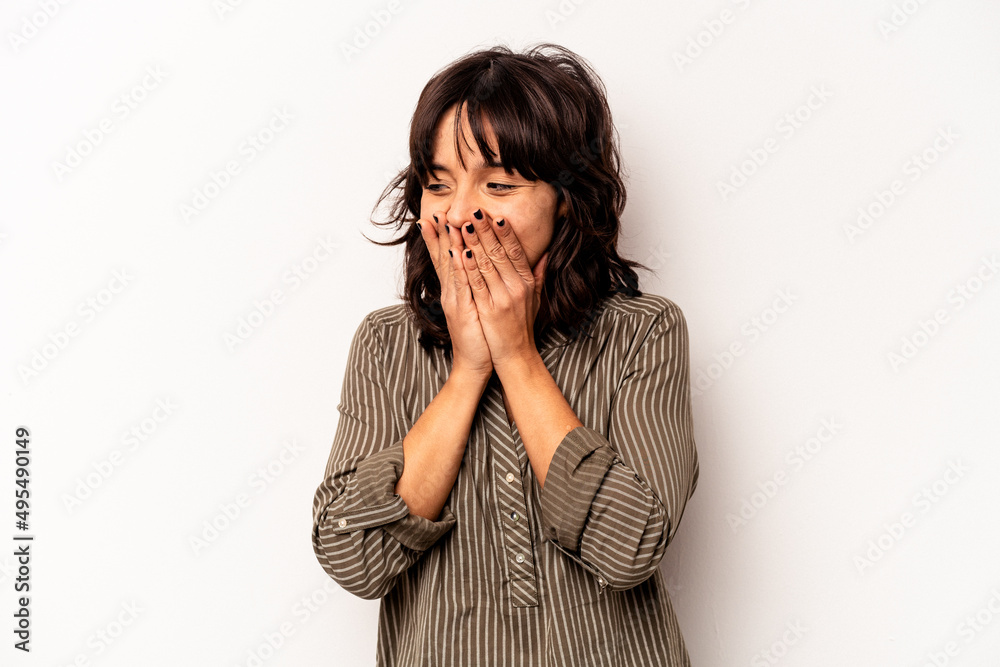 Young hispanic woman isolated on white background laughing about something, covering mouth with hands. Young hispanic woman isolated on white background laughing about something, covering mouth with hands.