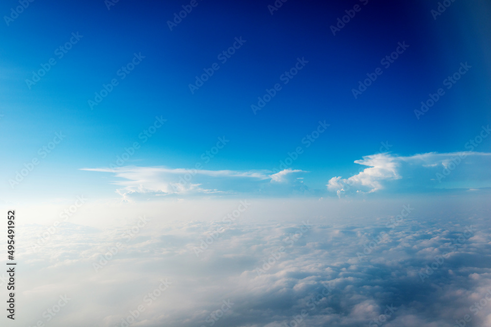 Blue sky and white cloud from airplane window Blue sky and white cloud from airplane window