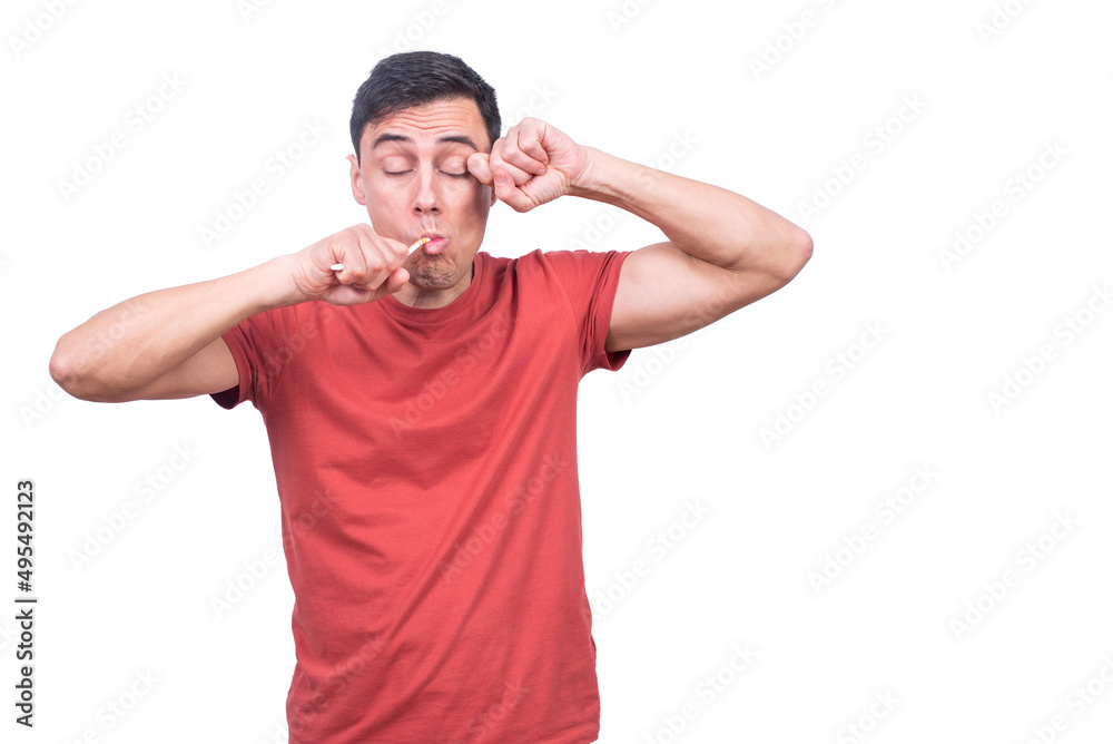 Sleepy guy brushing teeth on white backdrop Sleepy guy brushing teeth on white backdrop
