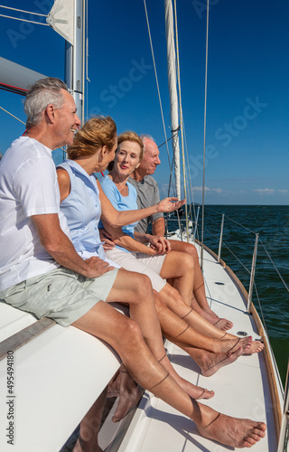 Senior couples enjoying outdoor lifestyle on private yacht © Spotmatik