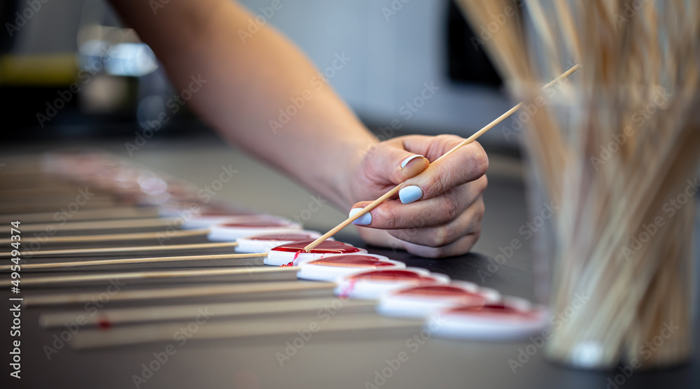 Close-up, the process of making lollipops from natural ingredients. Close-up, the process of making lollipops from natural ingredients.