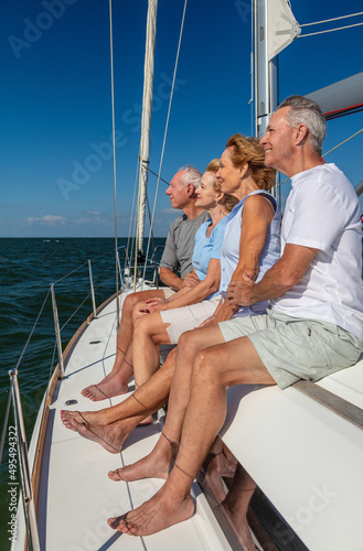 Happy group of retired friend relaxing on yacht © Spotmatik